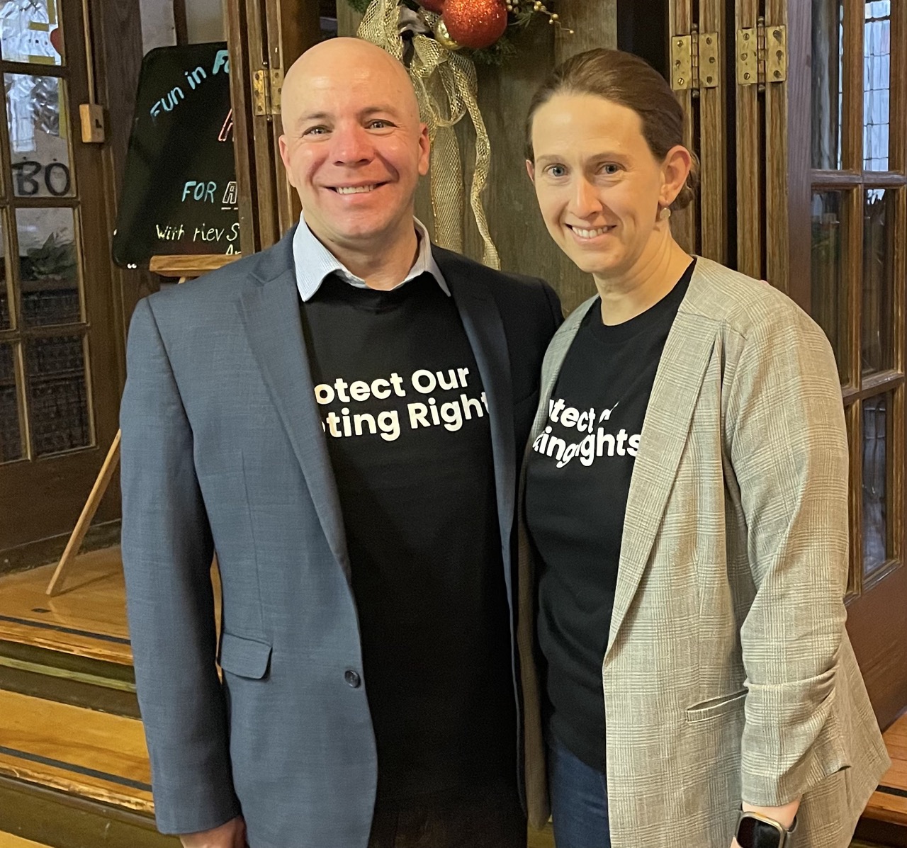 Melanie Macey and Scott Allison in matching Voting Rights t-shirts